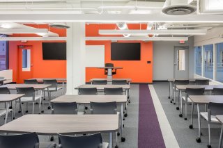 New modern offices and contemporary classroom space juxtaposed with a historical building and location in downtown Rochester, Minnesota create a vibrant atmosphere for a forward-thinking university. Winona State University - Rochester desired a downtown location to strengthen its position as a viable pathway to healthcare careers.

Not all historic renovations are classified as preservation projects. On the third floor of the Historic Riverside building, the WSU - Rochester project renovated and modernized a space that had been renovated many times throughout the years.  Due to the many renovations, very few original elements of the building remained.  Modern fixtures and lively splashes of color provided a desirable indoor environment within the history-rich building.