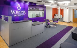 New modern offices and contemporary classroom space juxtaposed with a historical building and location in downtown Rochester, Minnesota create a vibrant atmosphere for a forward-thinking university. Winona State University - Rochester desired a downtown location to strengthen its position as a viable pathway to healthcare careers.

Not all historic renovations are classified as preservation projects. On the third floor of the Historic Riverside building, the WSU - Rochester project renovated and modernized a space that had been renovated many times throughout the years.  Due to the many renovations, very few original elements of the building remained.  Modern fixtures and lively splashes of color provided a desirable indoor environment within the history-rich building.
